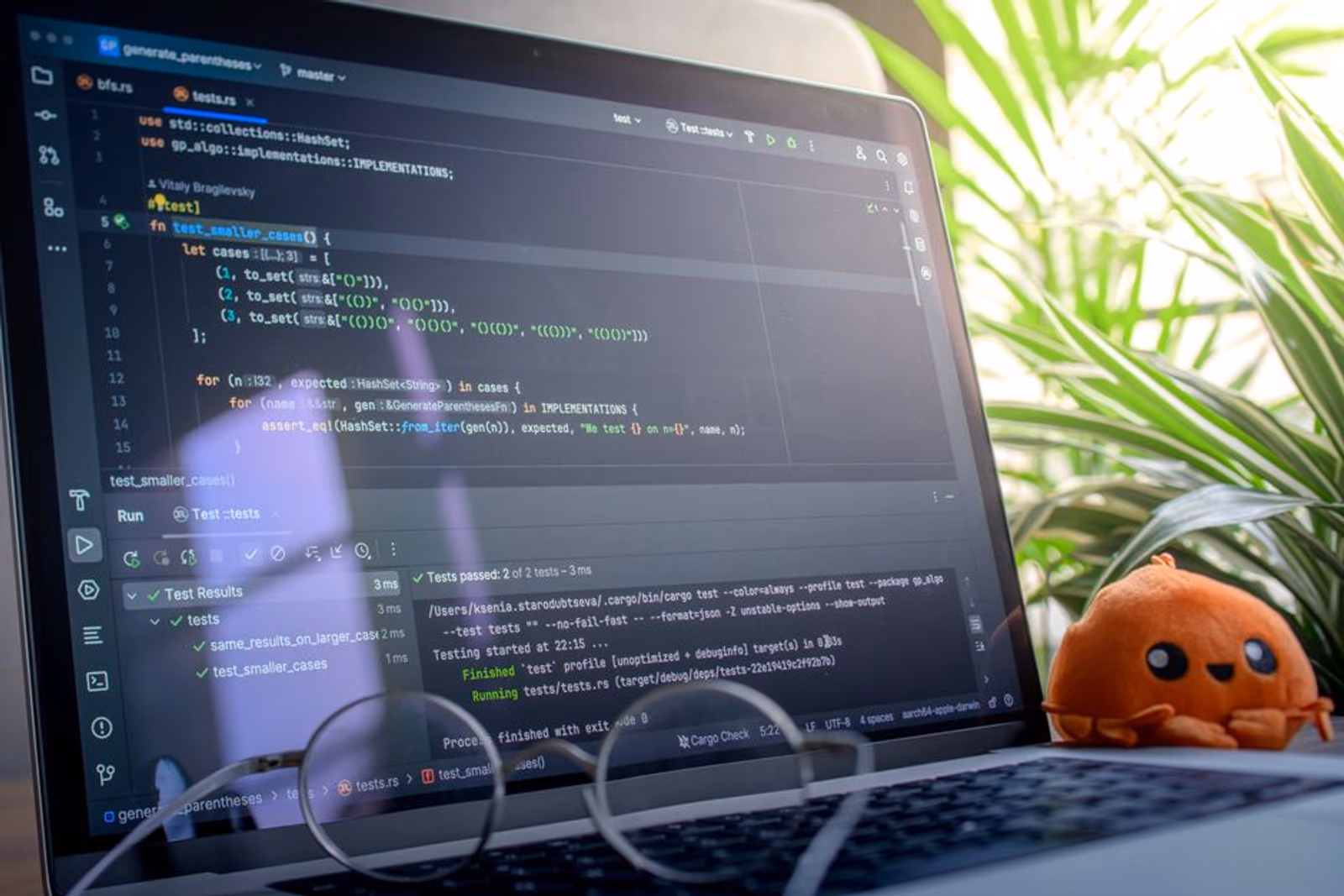 Developer reviewing AI agent test environment setup on dual monitors in a modern office