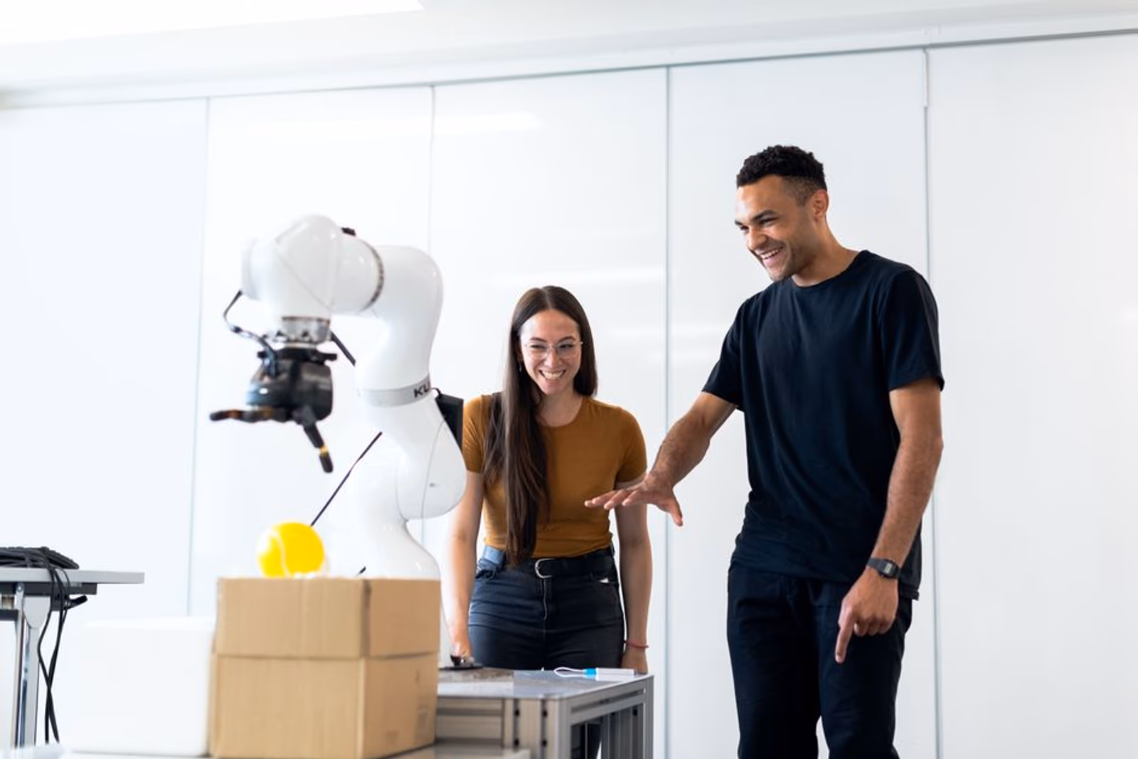 A mobile app growth team reviewing AI agent dashboards on multiple screens in a modern office