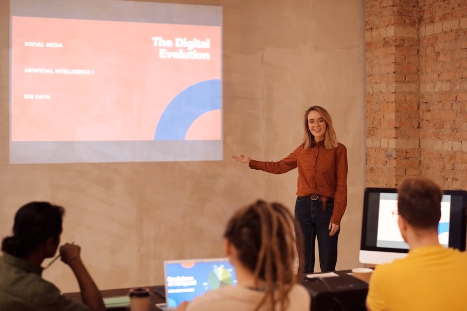 A digital marketing team reviewing AI agent dashboards showing paid user acquisition metrics and campaign performance data