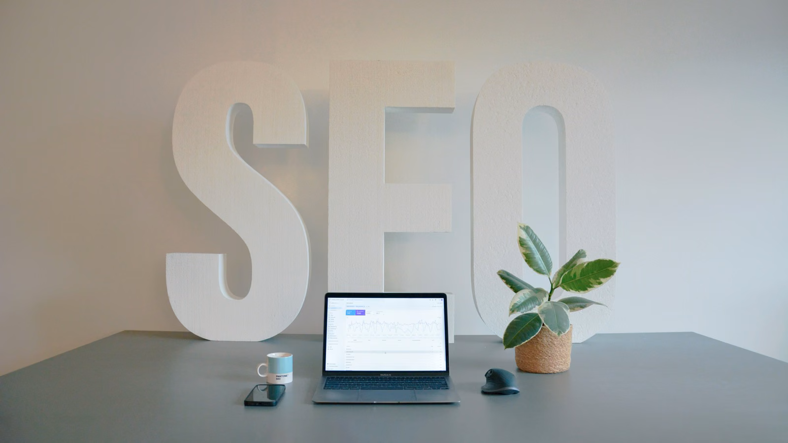 Performance marketer reviewing Apple Search Ads keyword bids and match-type performance on a clean desktop setup.
