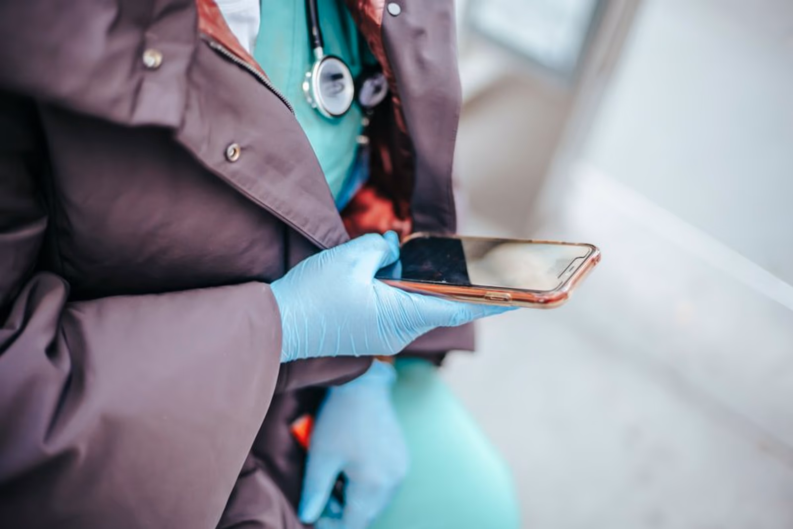 Mobile healthcare app interface displayed on a smartphone with medical icons and a search bar overlay