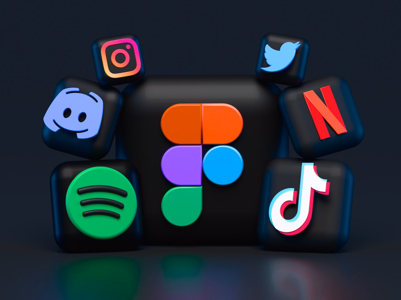 3D rendering of popular app icons including Instagram, TikTok, Spotify, Figma, Discord, Netflix, and Twitter on a dark background.