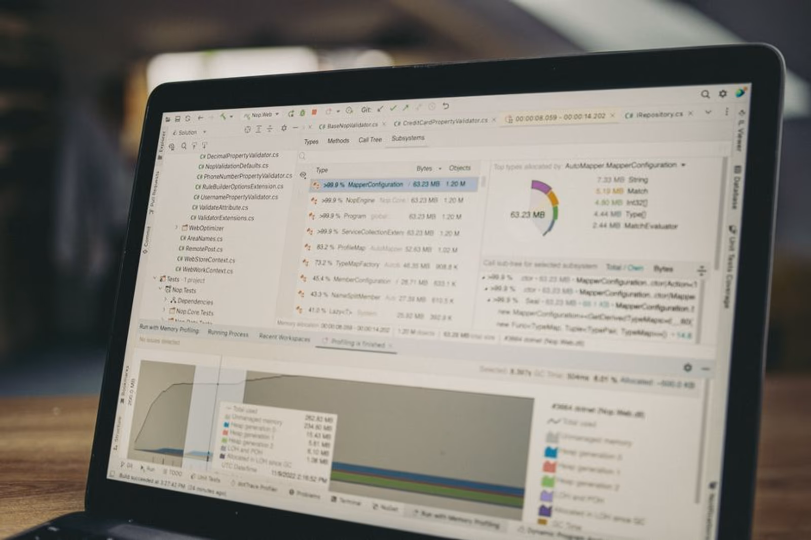 Side-by-side software comparison of n8n, Zapier, and Make automation platforms on a laptop screen