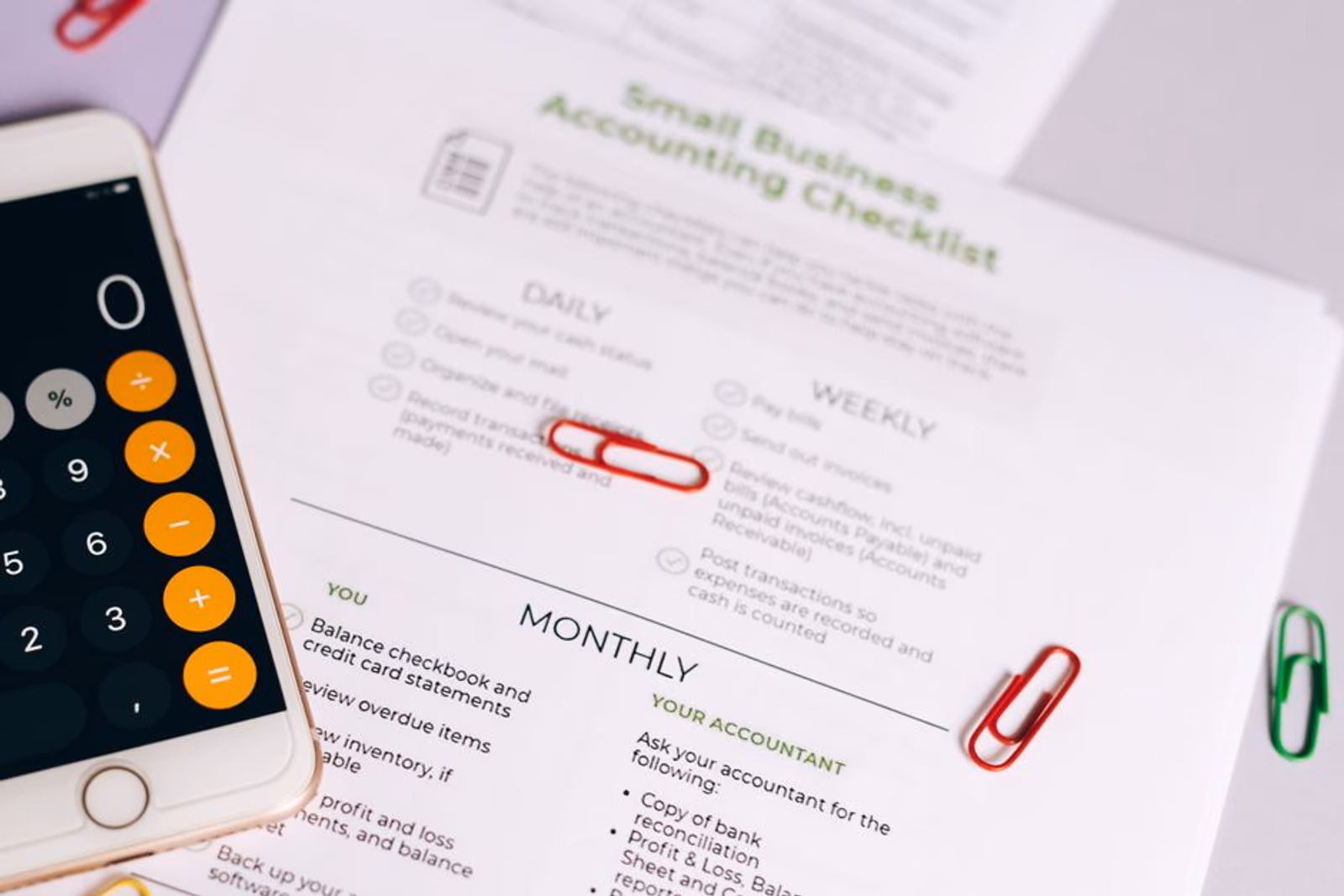 Mobile phone displaying a pre-launch app store checklist on screen