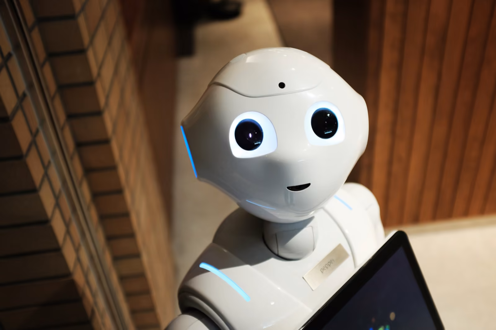 A friendly humanoid Pepper robot — the personable face of AI in everyday mobile products.