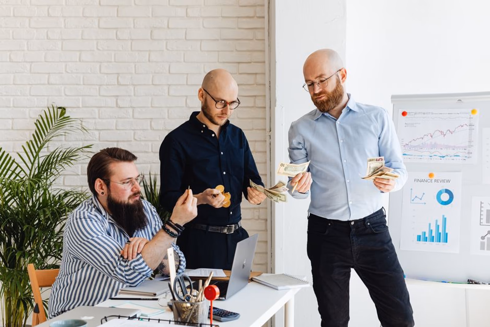 Startup founder sketching a mobile app marketing budget framework on a whiteboard