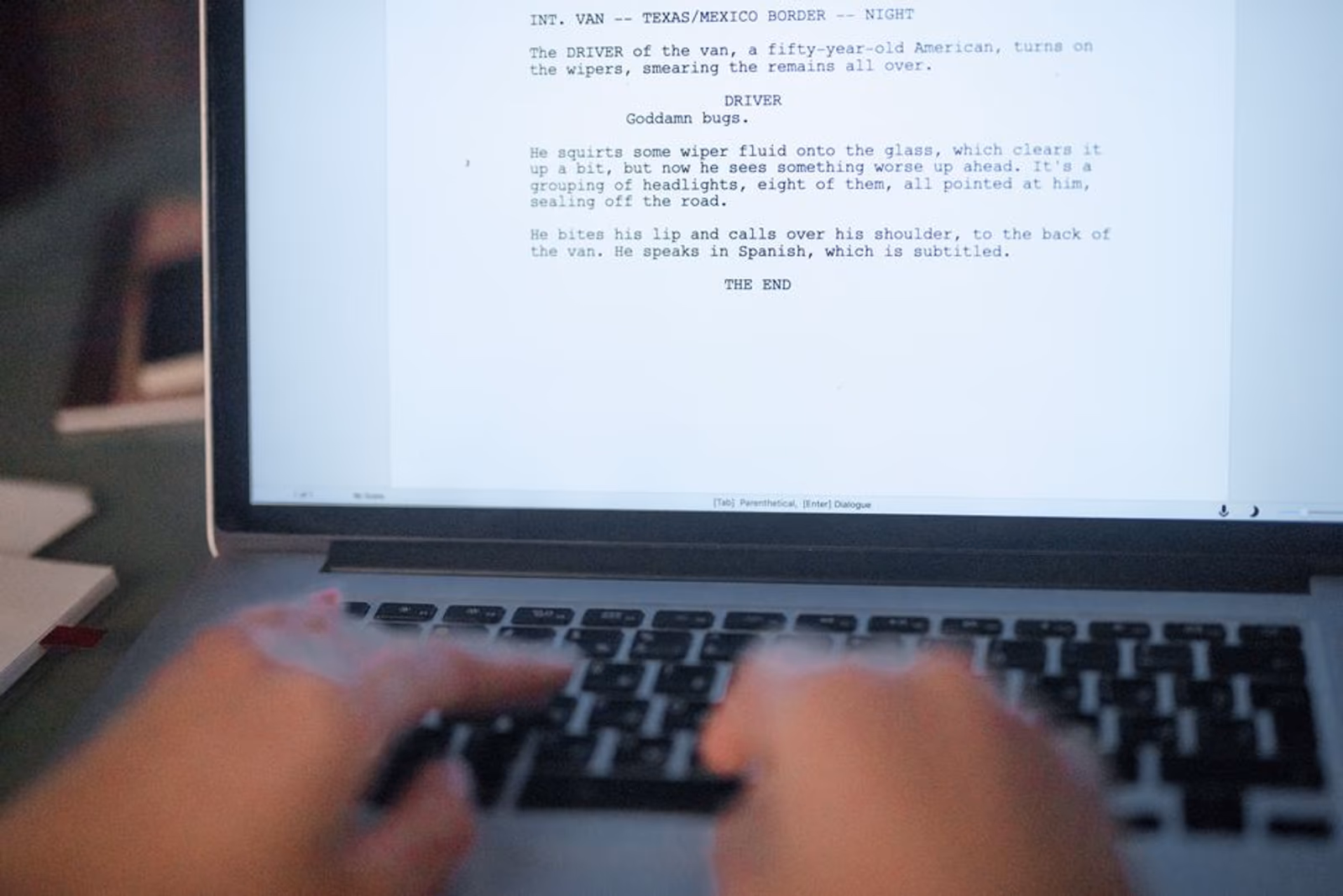 Person writing structured product page content on a laptop screen