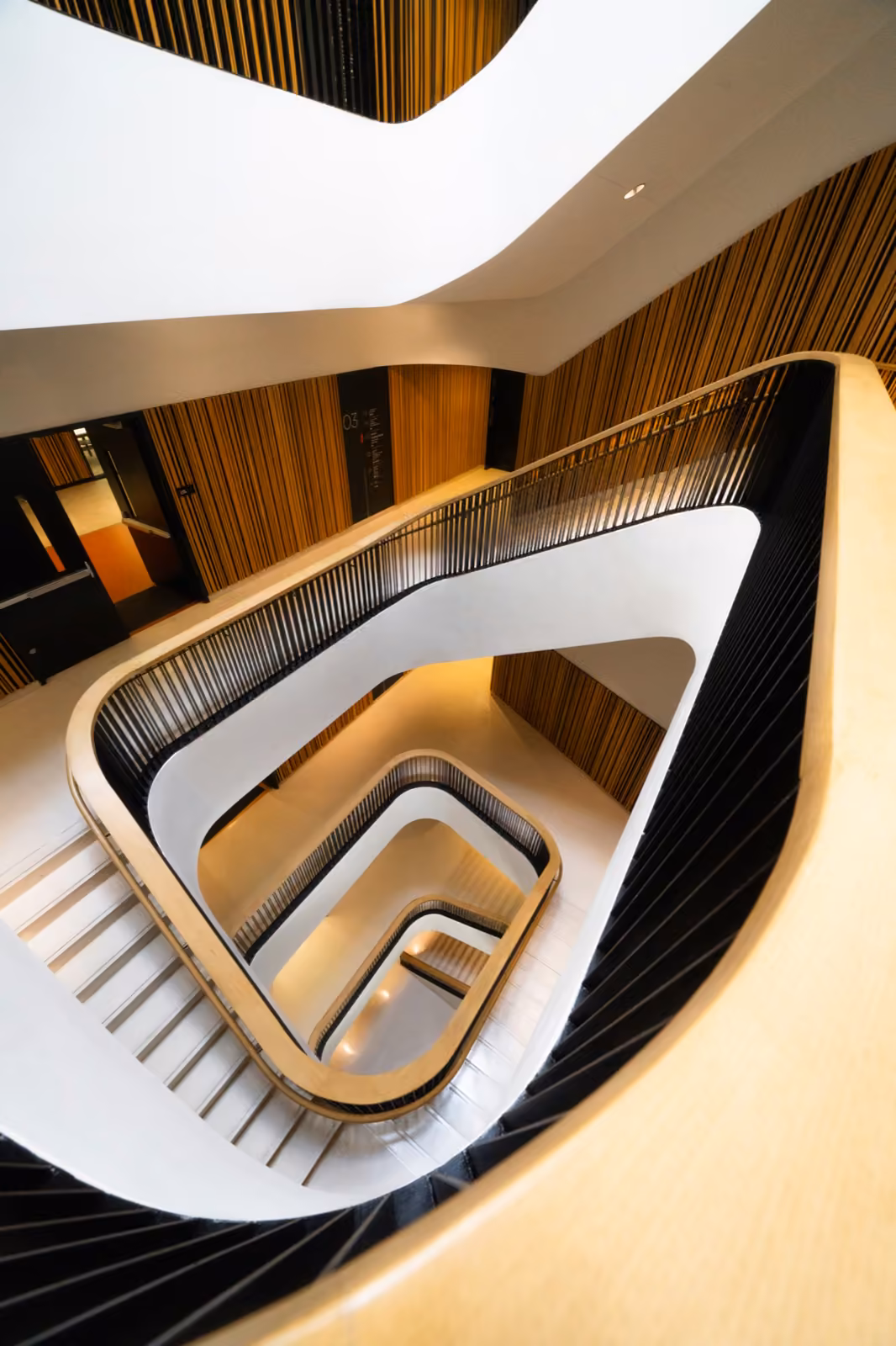 An architectural spiral staircase — the layered design behind a marketplace platform.