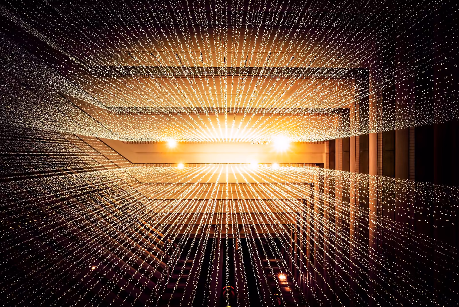 A tunnel of light receding into the distance — the visual of growth and revenue trajectory.
